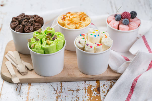istock Selection of different rolled ice creams in cone cups 938186338