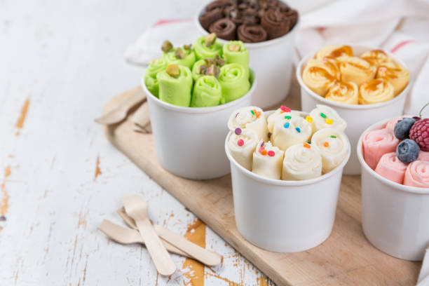 istock Selection of different rolled ice creams in cone cups 938186380