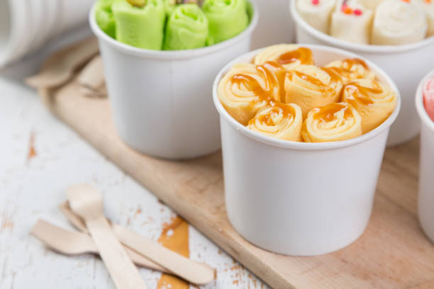istock Selection of different rolled ice creams in cone cups 938186430