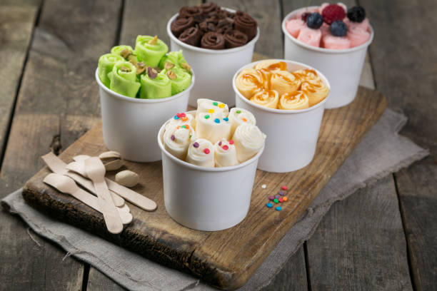 istock Selection of different rolled ice creams in cone cups 938186522