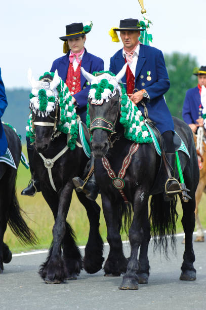every year at Whitsun a catholic horse procession with many riders in traditional costume takes place in Kötzting, Bavaria, Germany every year at Whitsun a catholic horse procession with many riders in traditional costume takes place in Kötzting, Bavaria, Germany whitsun stock pictures, royalty-free photos & images