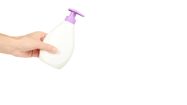 istock White hand sanitizer soap dispenser in hand isolated on white background. Housework and sanitary concept. copy space, template 938186716