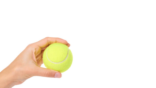 istock Single tennis ball in hand isolated on white background. copy space, template 938187082