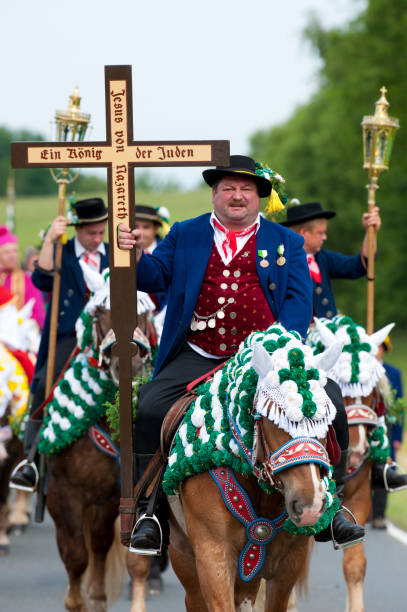 every year at Whitsun a catholic horse procession with many riders in traditional costume takes place in Kötzting, Bavaria, Germany every year at Whitsun a catholic horse procession with many riders in traditional costume takes place in Kötzting, Bavaria, Germany whitsun stock pictures, royalty-free photos & images