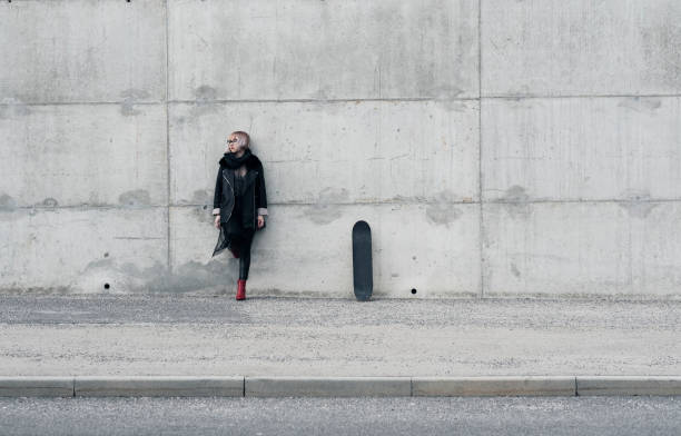 istock Young fashionable woman with skateboard 938199416