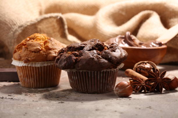 istock Chocolate muffin and nut muffin, homemade bakery on grey background 938199864