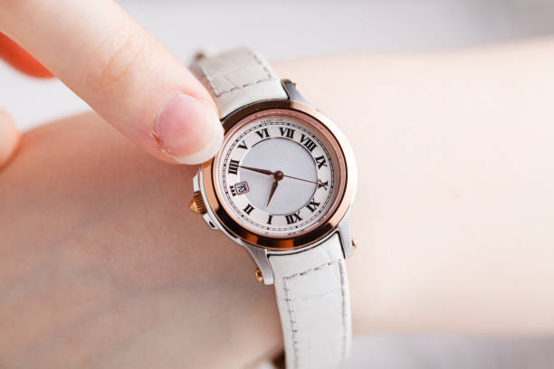 istock Checking time, female wrist watch on hand 938199996