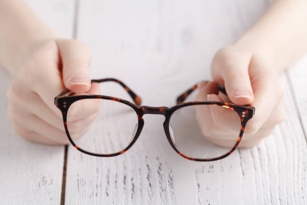 istock Holding glasses in female hands 938204804