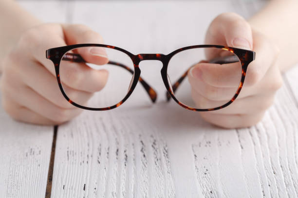 istock Holding glasses in female hands 938205164