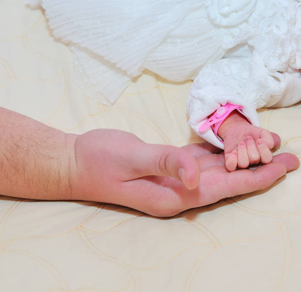istock Image of newborn baby hand 938205878