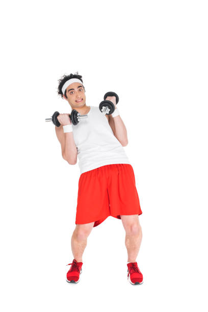 istock Thin man in headband exercising with dumbbells isolated on white 938206052