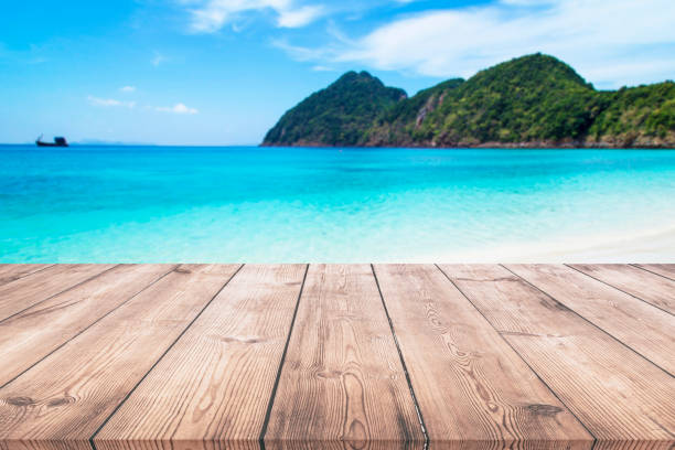 istock Wooden table with seascape background 938206882