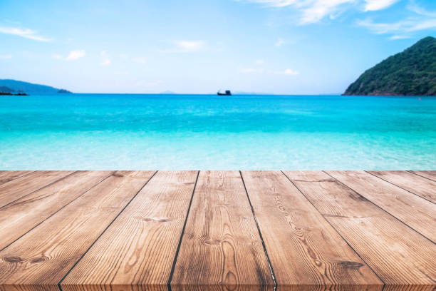 istock Wooden table with seascape background 938206910