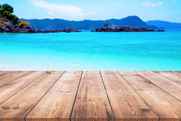 istock Wooden table with seascape background 938206944
