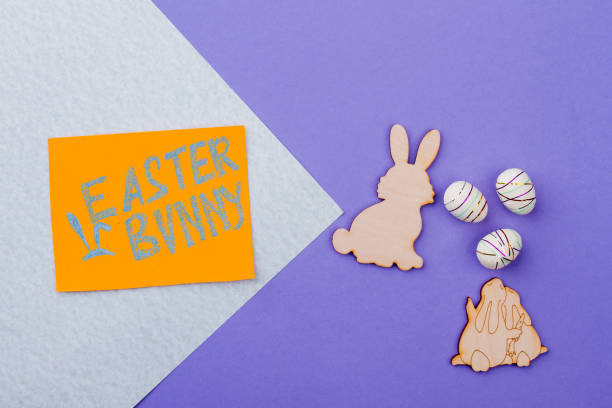 istock Easter plywood rabbits and styrofoam eggs. 938210054