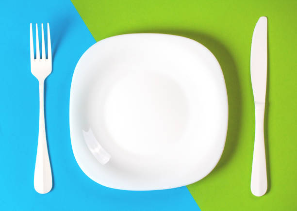 istock Plate fork knife Cutlery Kitchen concept restaurant menu meal art background blue green 938210634