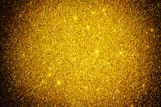 istock Abstract golden sparkle glitter shiny holiday texture. Gold shallow depth background. Greeting card template. Copy space 938211060