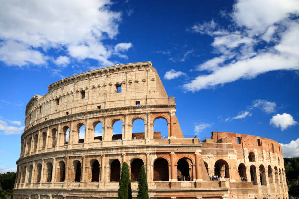 istock Colosseum with clear blue sky and clouds, Rome 938218554