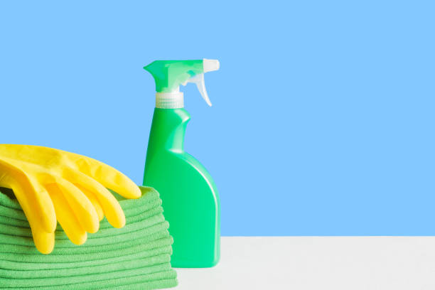 istock Simple cleaning set for different surfaces in kitchen, bathroom and other rooms. Empty place for text or logo on blue background. Cleaning service concept. Early spring regular clean up. Front view. 938218568