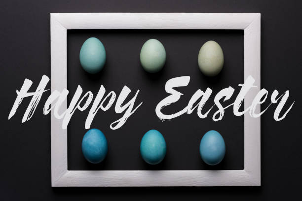 istock Happy Easter black and white background. DIY dyed shades of blue Easter eggs abstract minimal concept. 938222772
