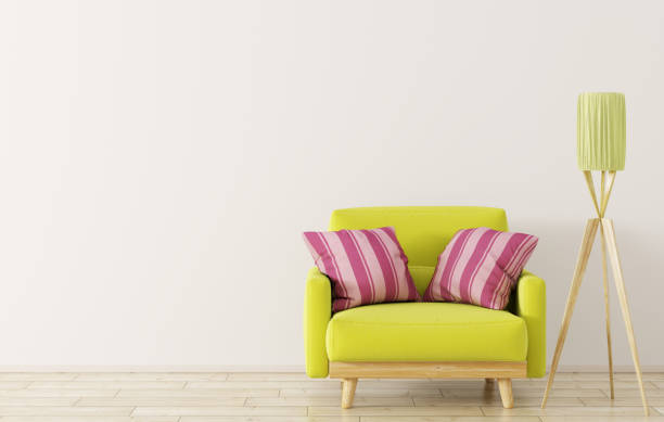 Young lady poses serious while sitting on an easy chair