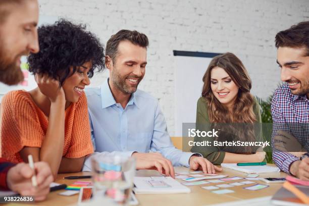 Happy Web Designers Developing New Web Site Layout In Office Stock Photo - Download Image Now