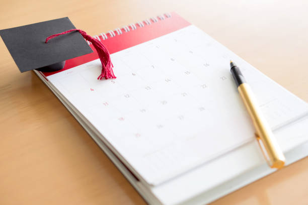 istock Pen on calendar and Graduation cap 938230482