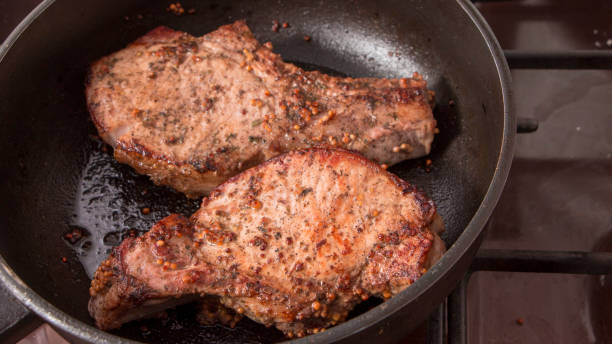 istock grilled beef steak with rosemary, frying pan 938235118