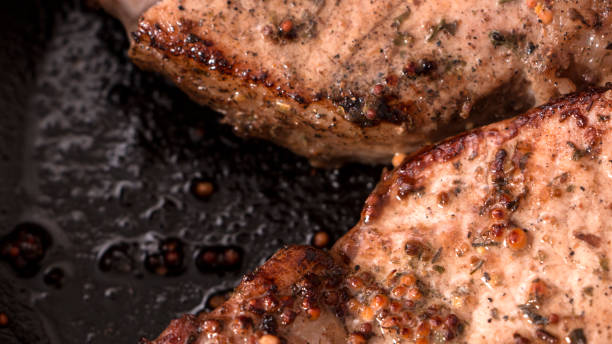 istock grilled beef steak with rosemary, frying pan 938235264