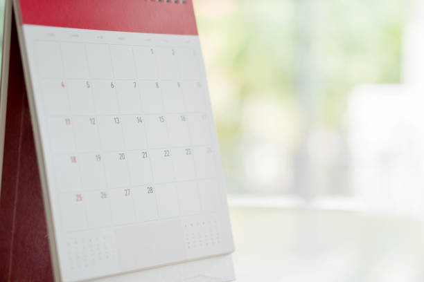 istock Calendar Standing On Brown Wood Surface 938235334