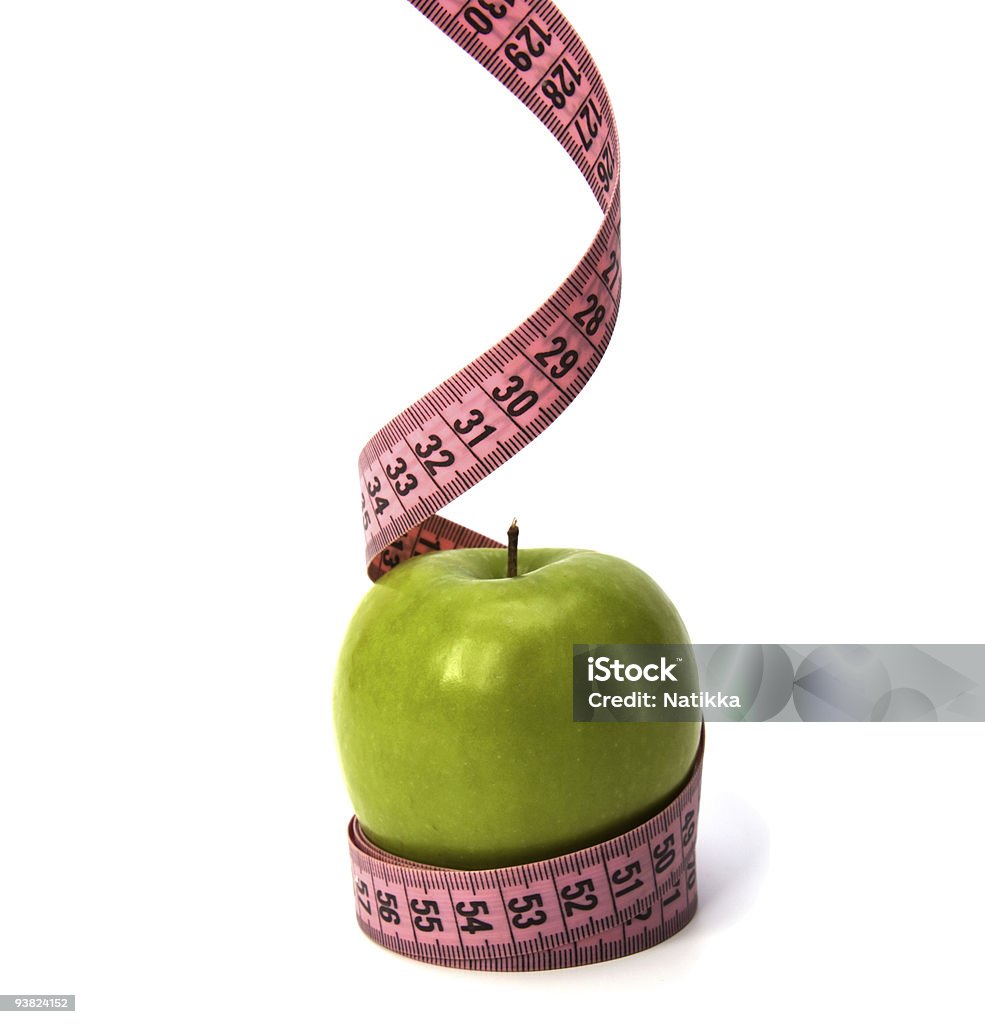 Fita métrica contornando a maçã verde - Foto de stock de Fita métrica royalty-free