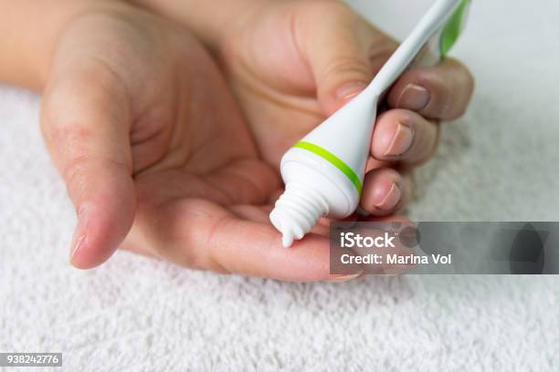 Ointment On Hand Applying The Ointment In The Treatment And Hydration Of The Skin Stock Photo - Download Image Now