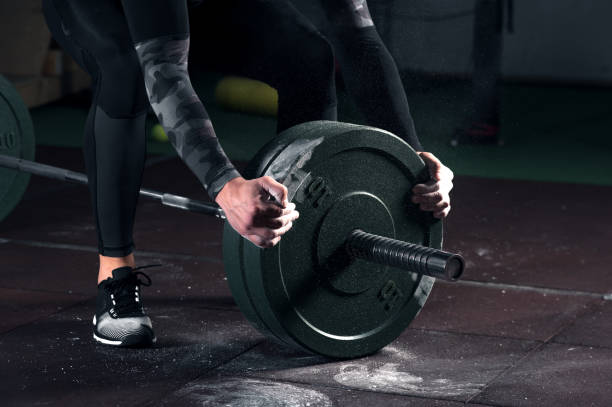 istock Close-up - Young muscular man working out in gym 938254868