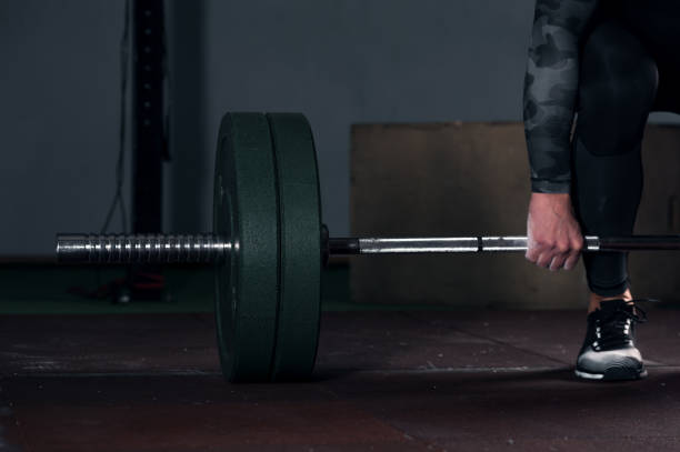 istock Close-up - Young muscular man working out in gym 938254910