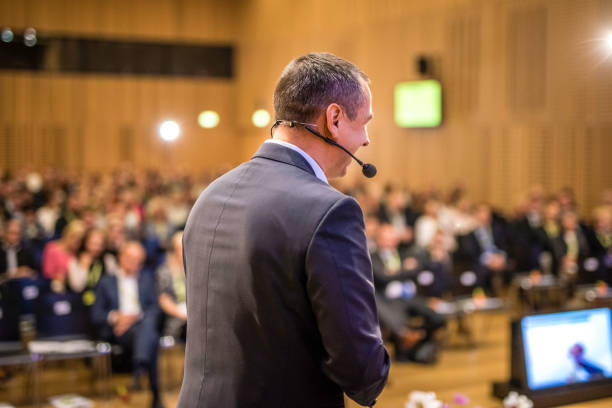 istock Rear view of motivational speaker 938254954