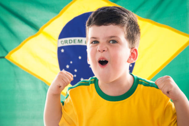 istock Young Brazilian boy soccer supporter 938259096