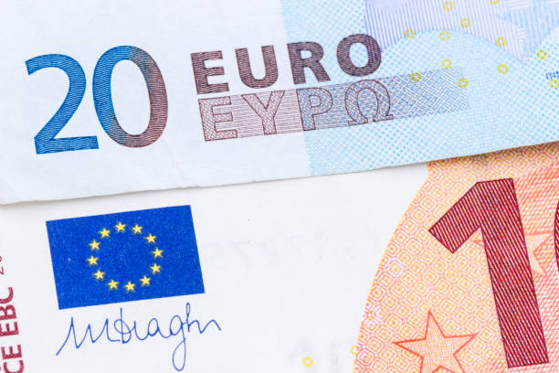 istock 20 euro banknotes close-up with euro flag.Background 938268466