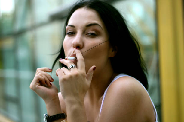 istock Smoking beautiful woman 938276160