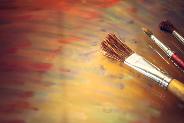 istock Art creative paintbrushes colorful paints background 938279992