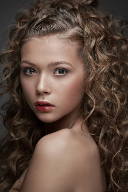 istock Pretty curly young woman 938280570