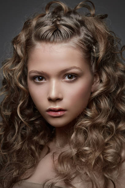 istock Pretty curly young woman 938280580