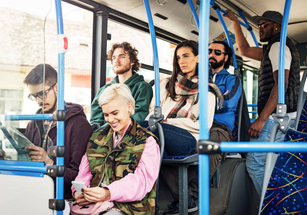 istock Lovely blonde looking at the phone while commuting by public bus 938284190