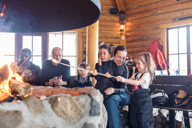 Families in a ski resort, apres-ski relaxing Families in a ski resort, apres-ski relaxing apres ski stock pictures, royalty-free photos & images