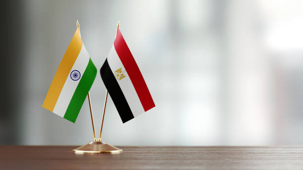 istock Indian And Egyptian Flag Pair On A Desk Over Defocused Background 938288198