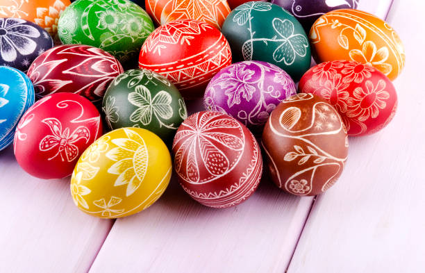 istock colorful scratched handmade Easter eggs on a wooden table 938288718