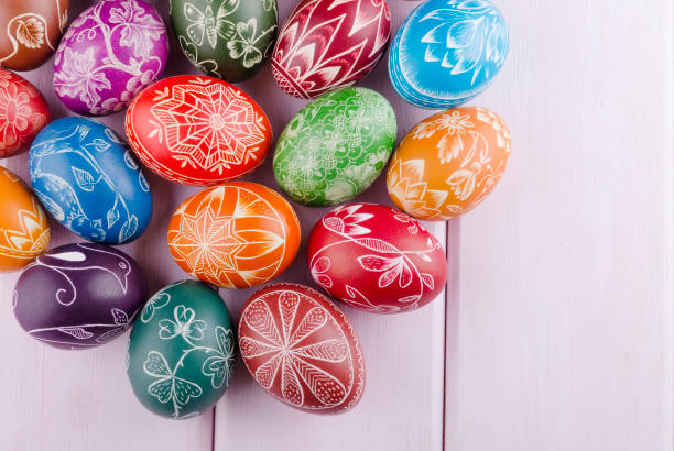 istock colorful scratched handmade Easter eggs on a wooden table 938288736