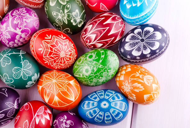 istock colorful scratched handmade Easter eggs on a wooden table 938288754