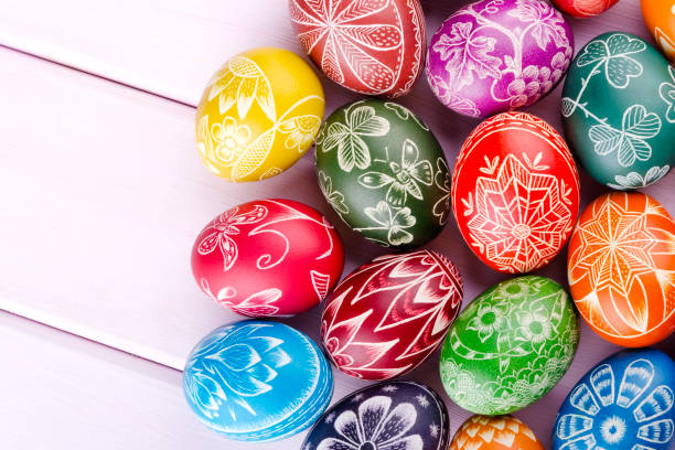 istock colorful scratched handmade Easter eggs on a wooden table 938288758
