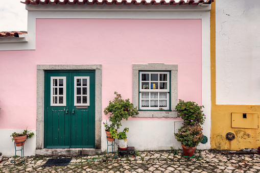 Colorful wooden door in the facade of a typical Portuguese house at Lisbon, Portugal.