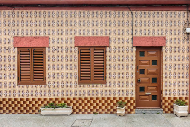 Colorful wooden door in the facade of a typical Portuguese house at Porto, Portugal.